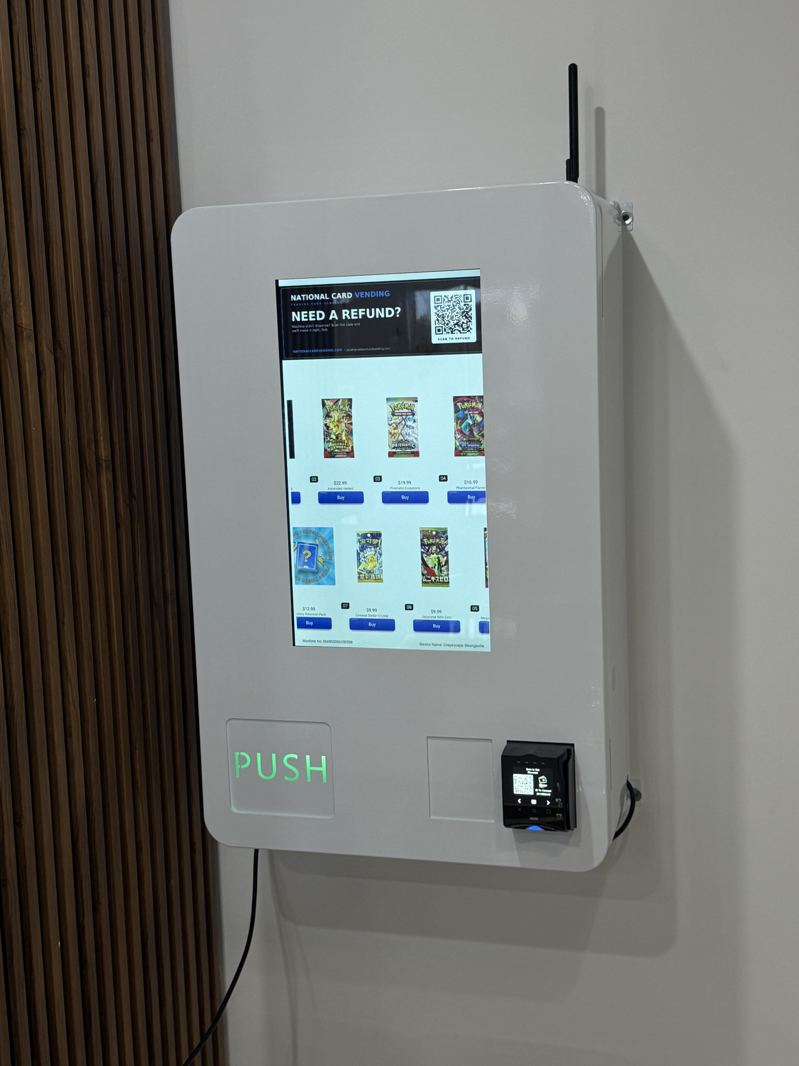 White wall-mounted kiosk with touchscreen and card reader